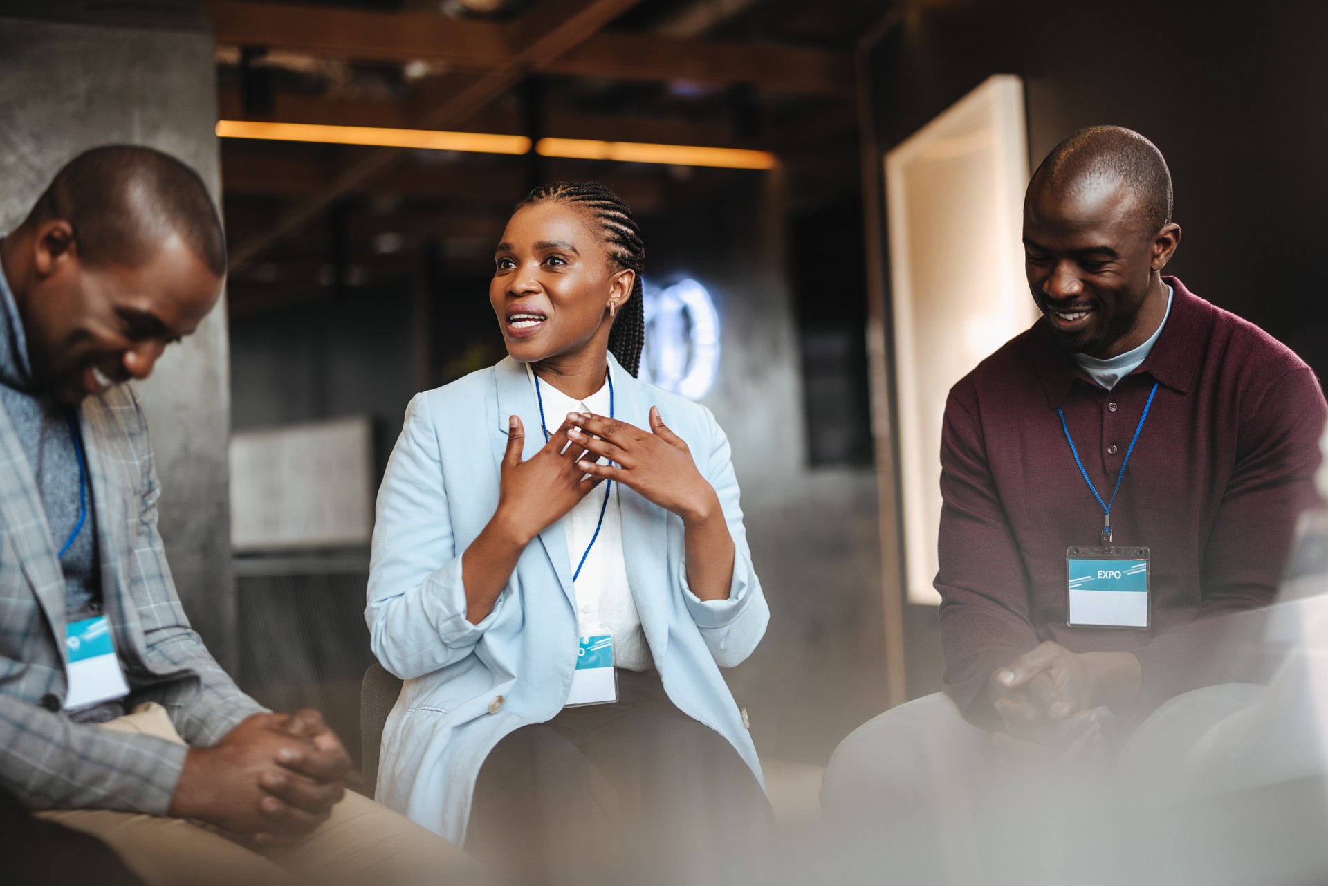 Business colleagues discussing with each other at a conference, networking in a corporate workplace